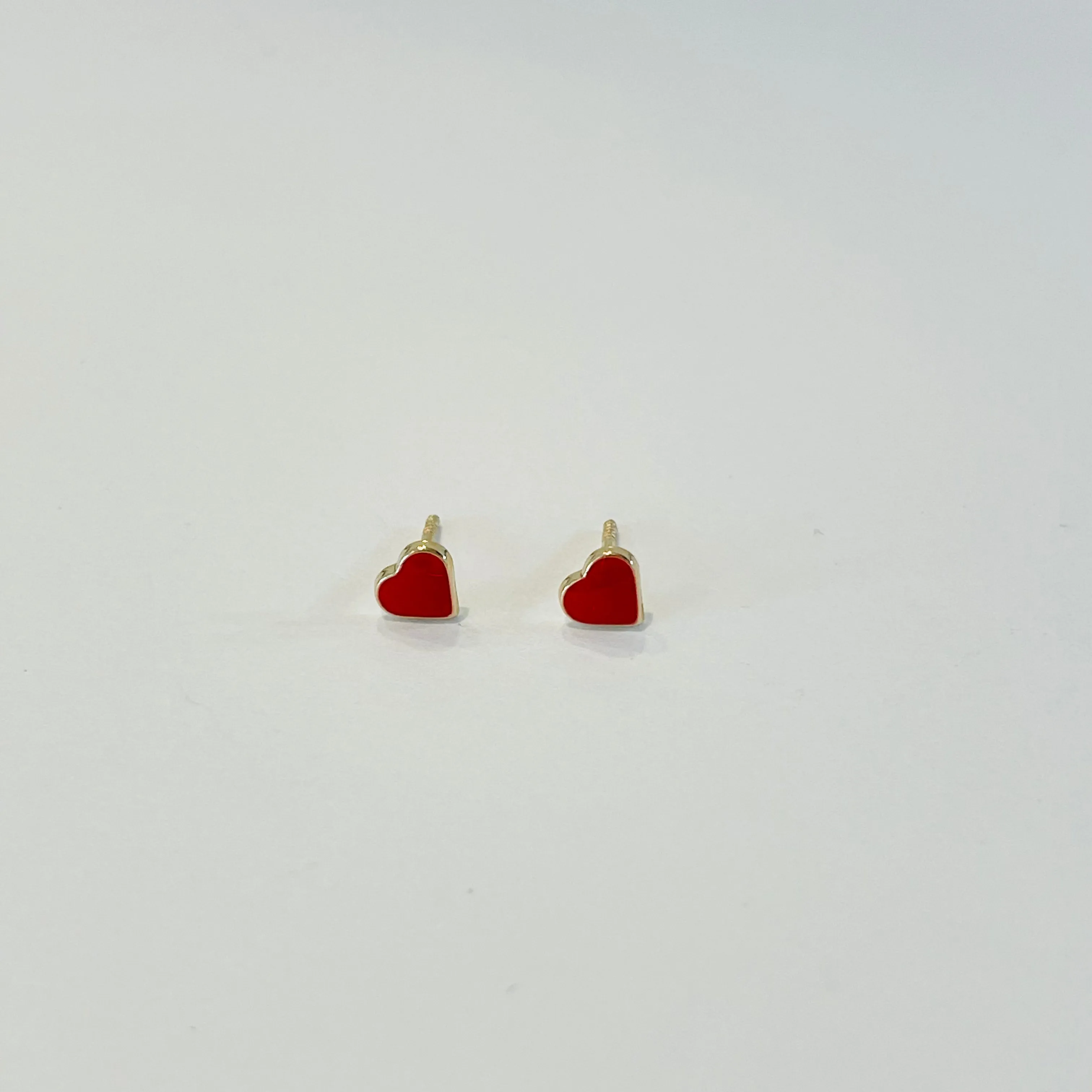 mini red enamel heart studs sold by Theodosia