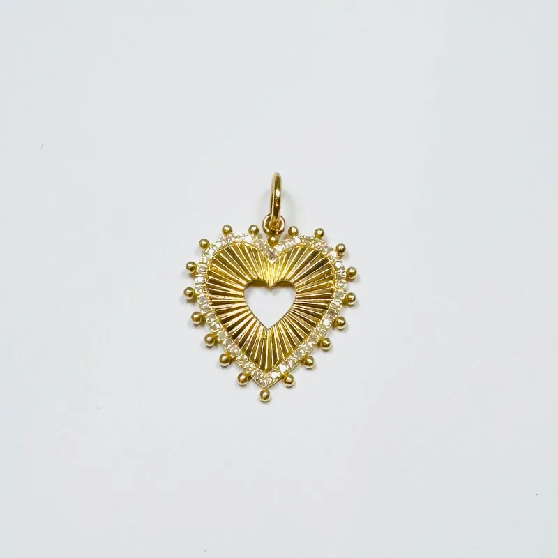 fluted cutout heart pendant sold by Theodosia