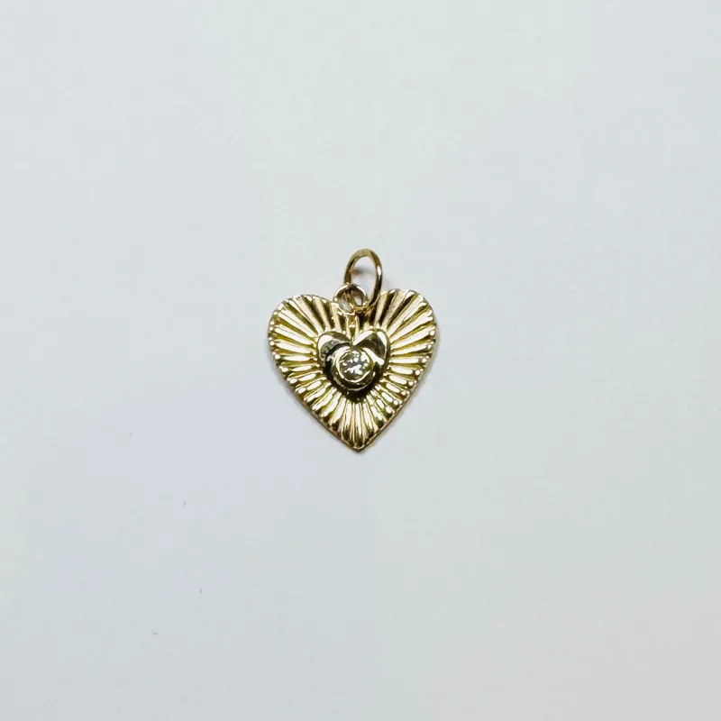 fluted heart pendant sold by Theodosia