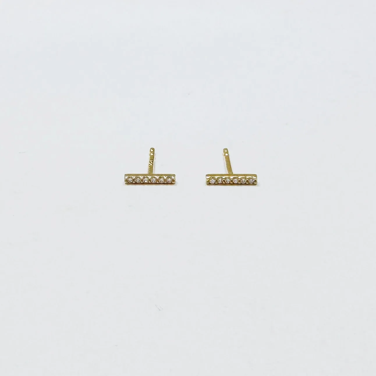 classic pave diamond bar studs sold by Theodosia