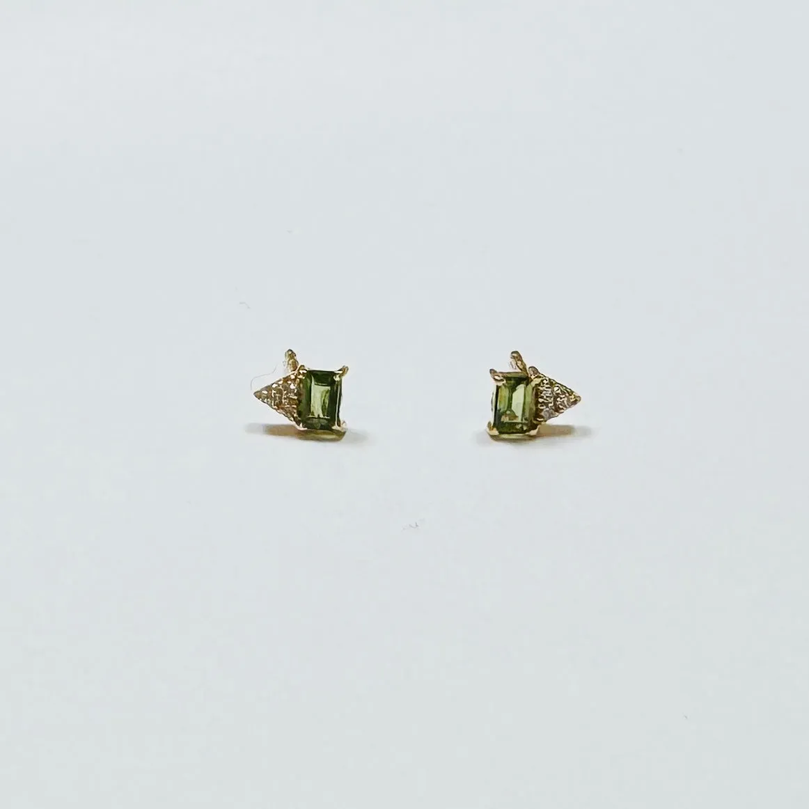 green sapphire baguette and diamond cluster studs sold by Theodosia