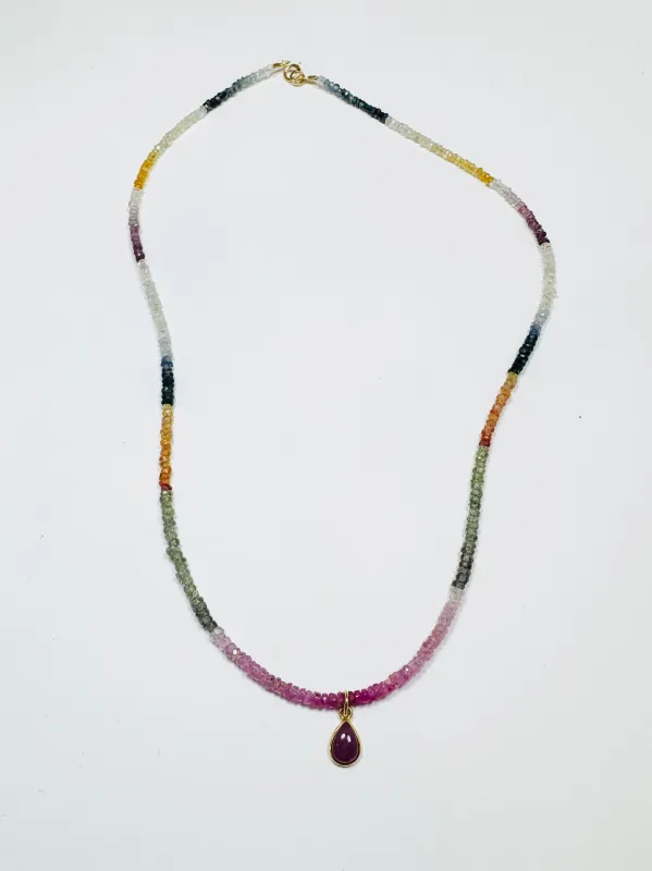sapphire heishi necklace with ruby bezel charm sold by Theodosia
