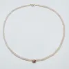 pink opal heishi necklace with bezel set pink tourmaline sold by Theodosia