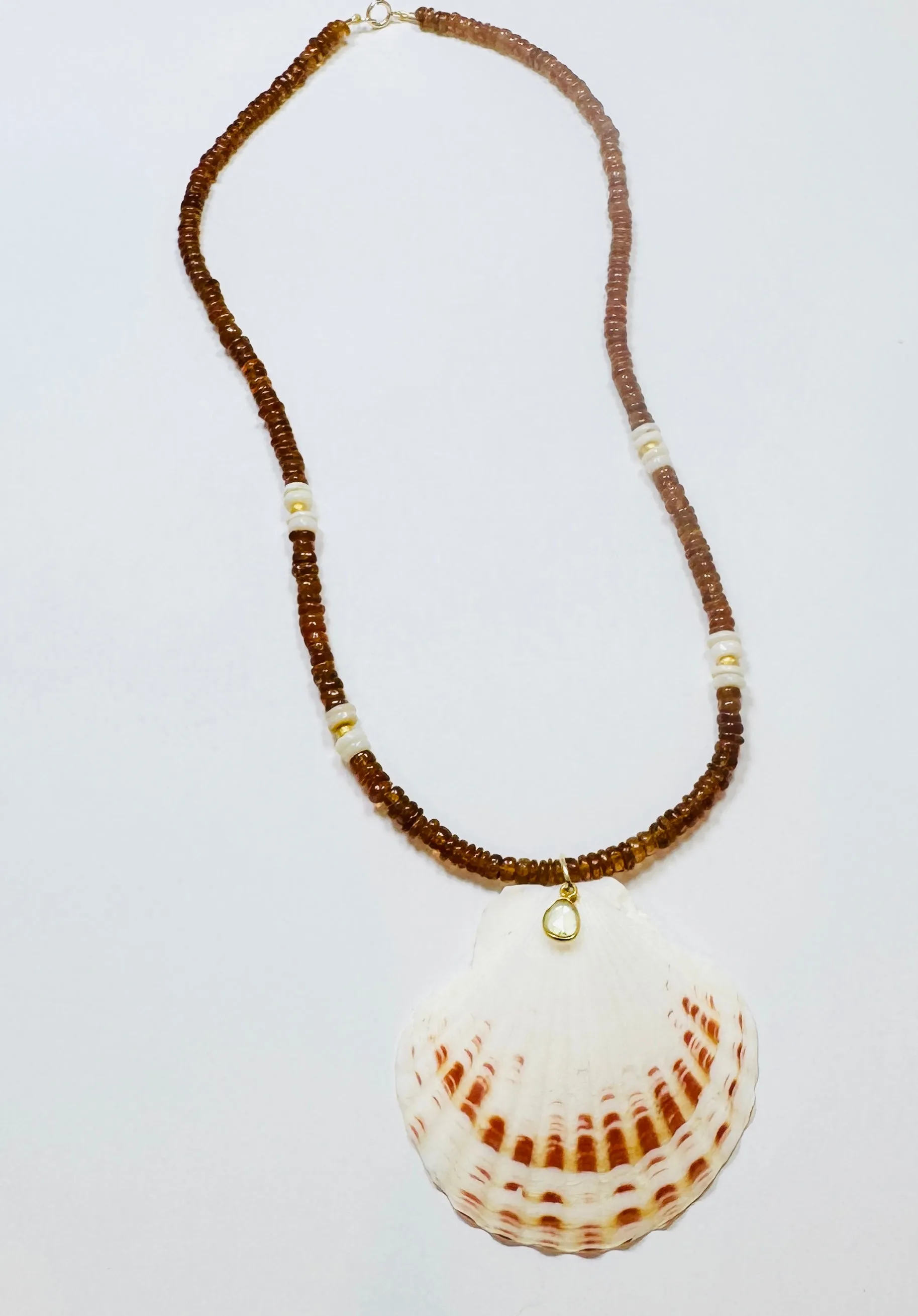 Hessonite and turquoise shell necklace with shell pendant sold by Theodosia
