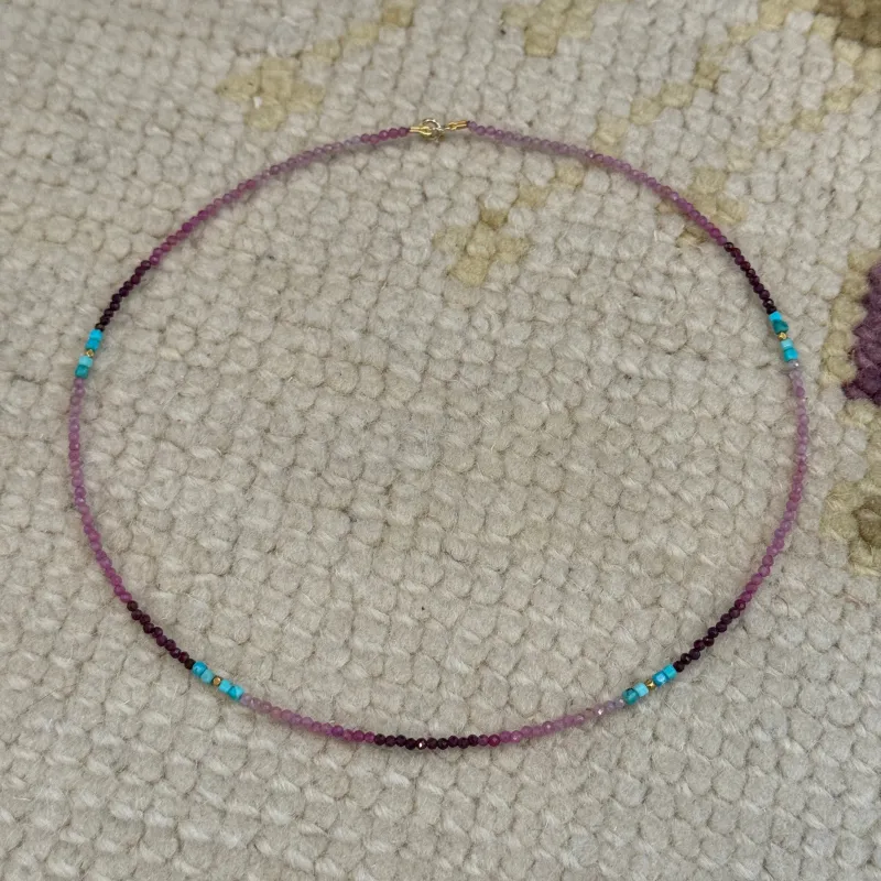 delicate shaded ruby necklace with turquoise and gold nuggets sold by Theodosia