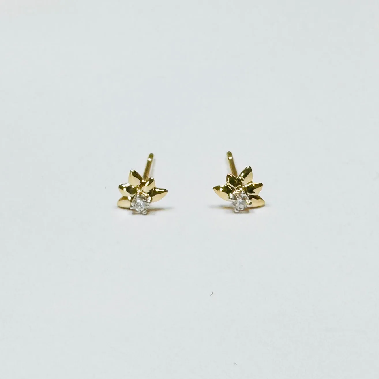 diamond leaf studs sold by Theodosia