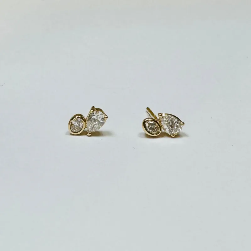oval teardrop diamond cluster studs sold by Theodosia
