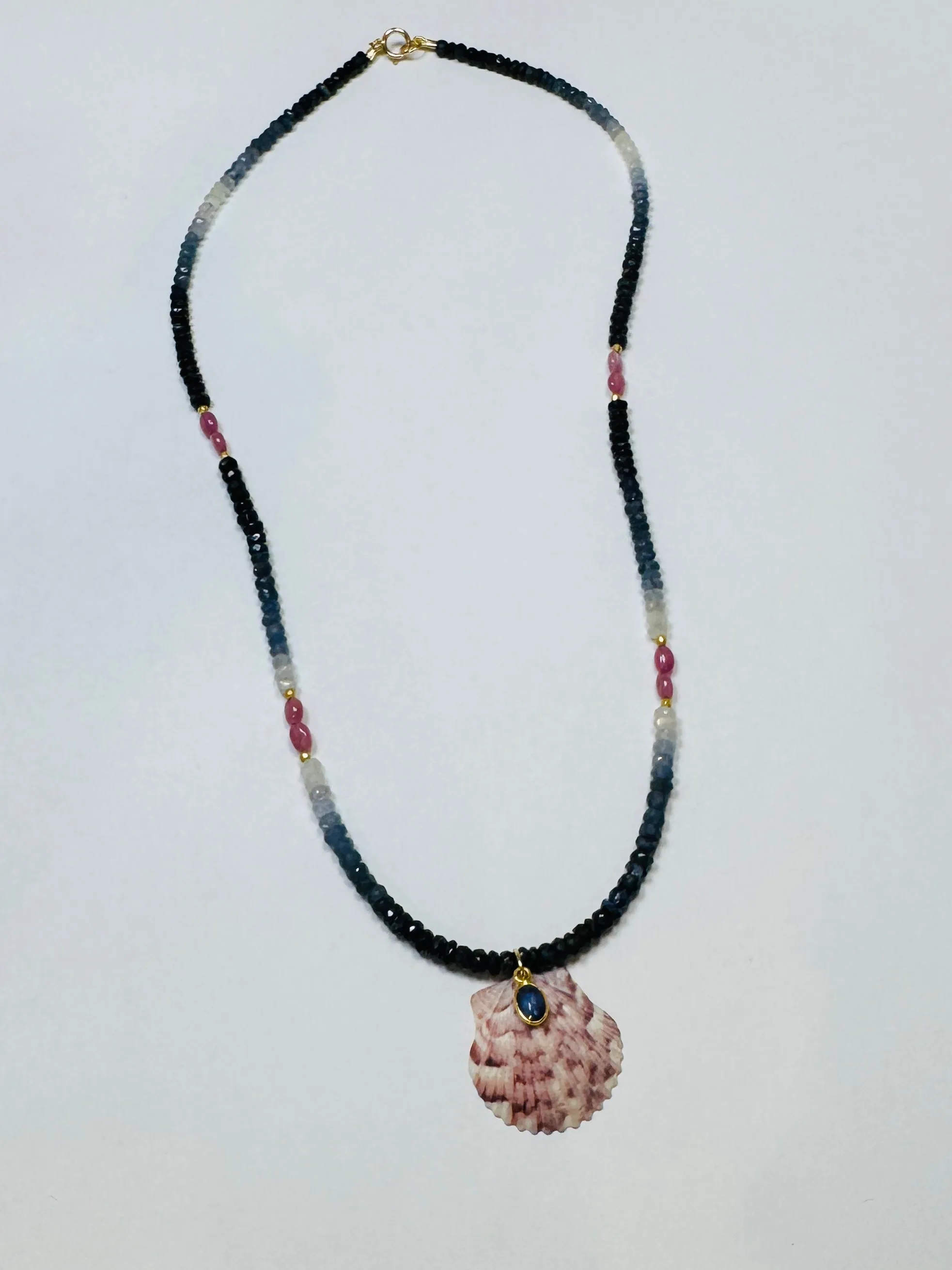 shaded blue and pink sapphire necklace with shell pendant sold by Theodosia