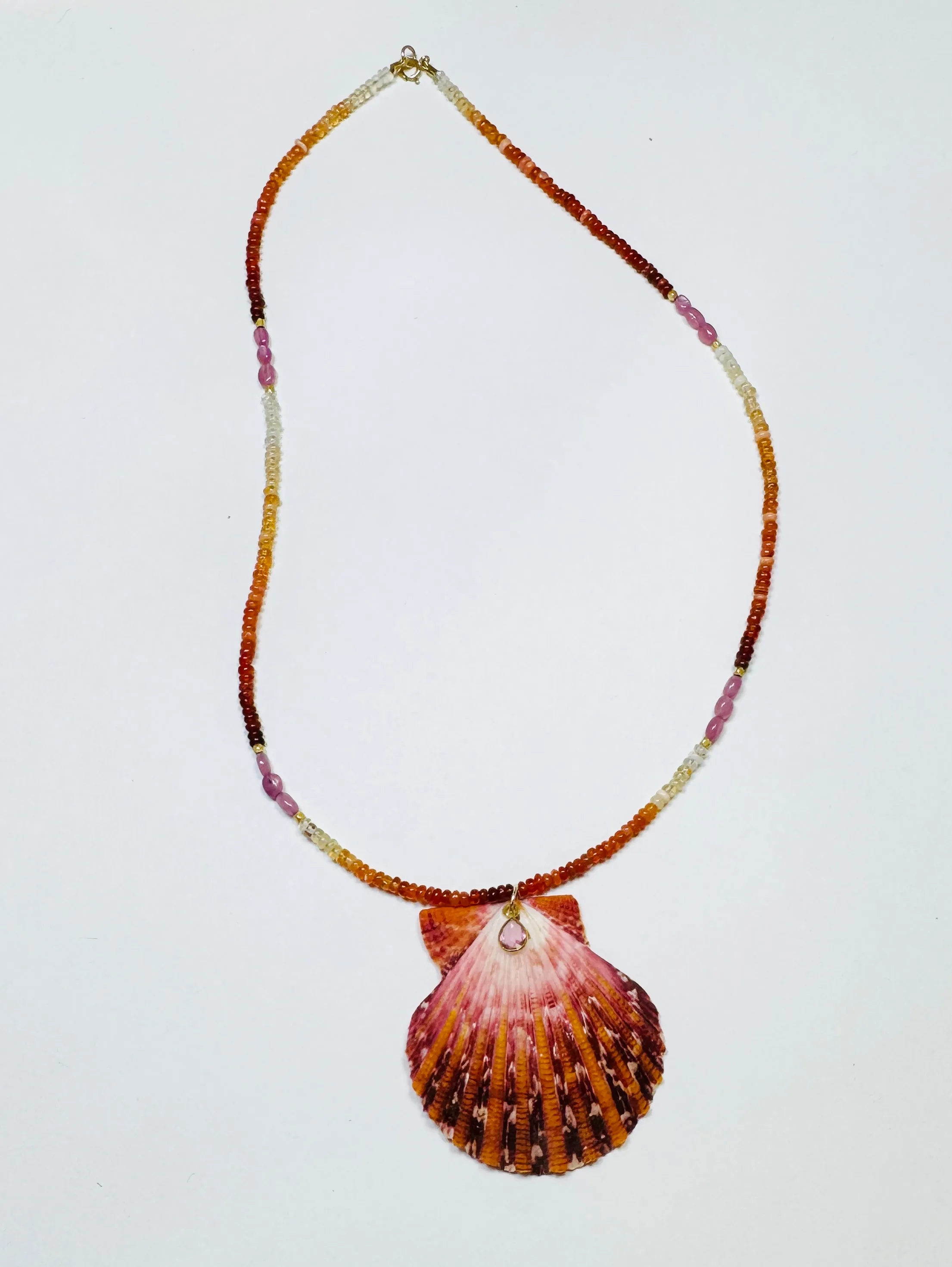 fire opal and pink sapphire necklace with shell pendant sold by Theodosia