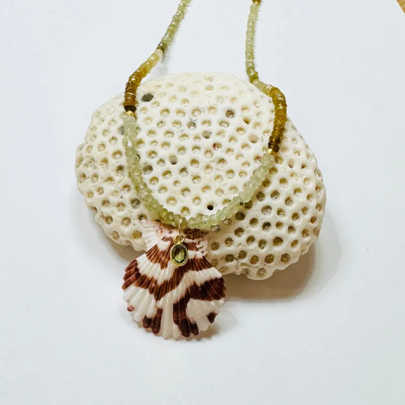 shaded hessonite garnet necklace with shell pendant sold by Theodosia