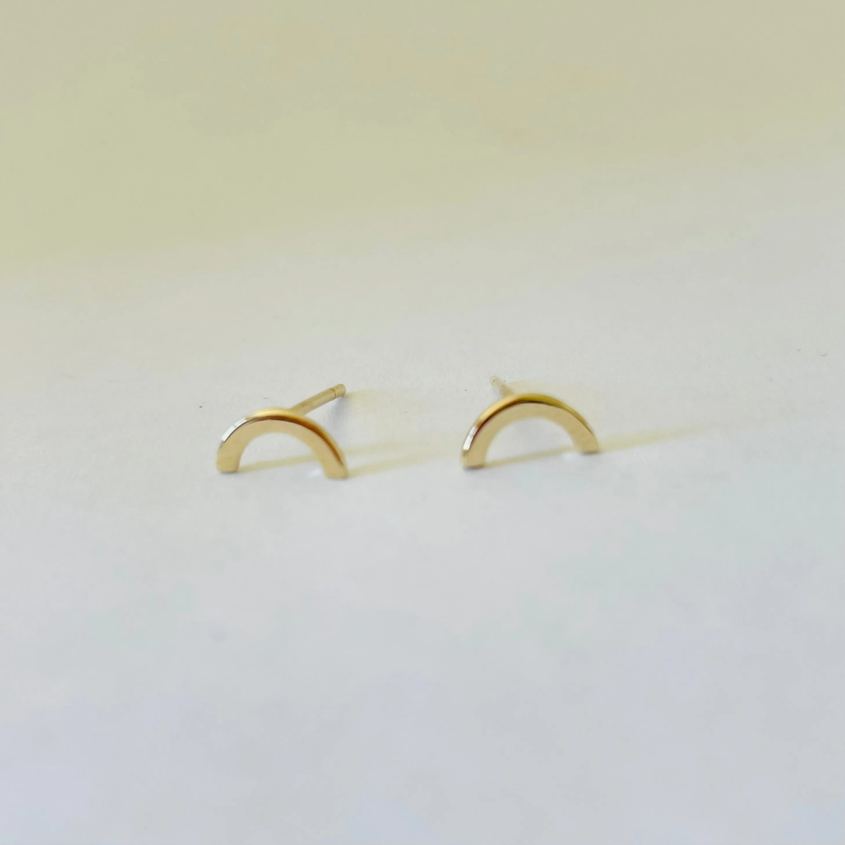 gold rainbow studs sold by Theodosia