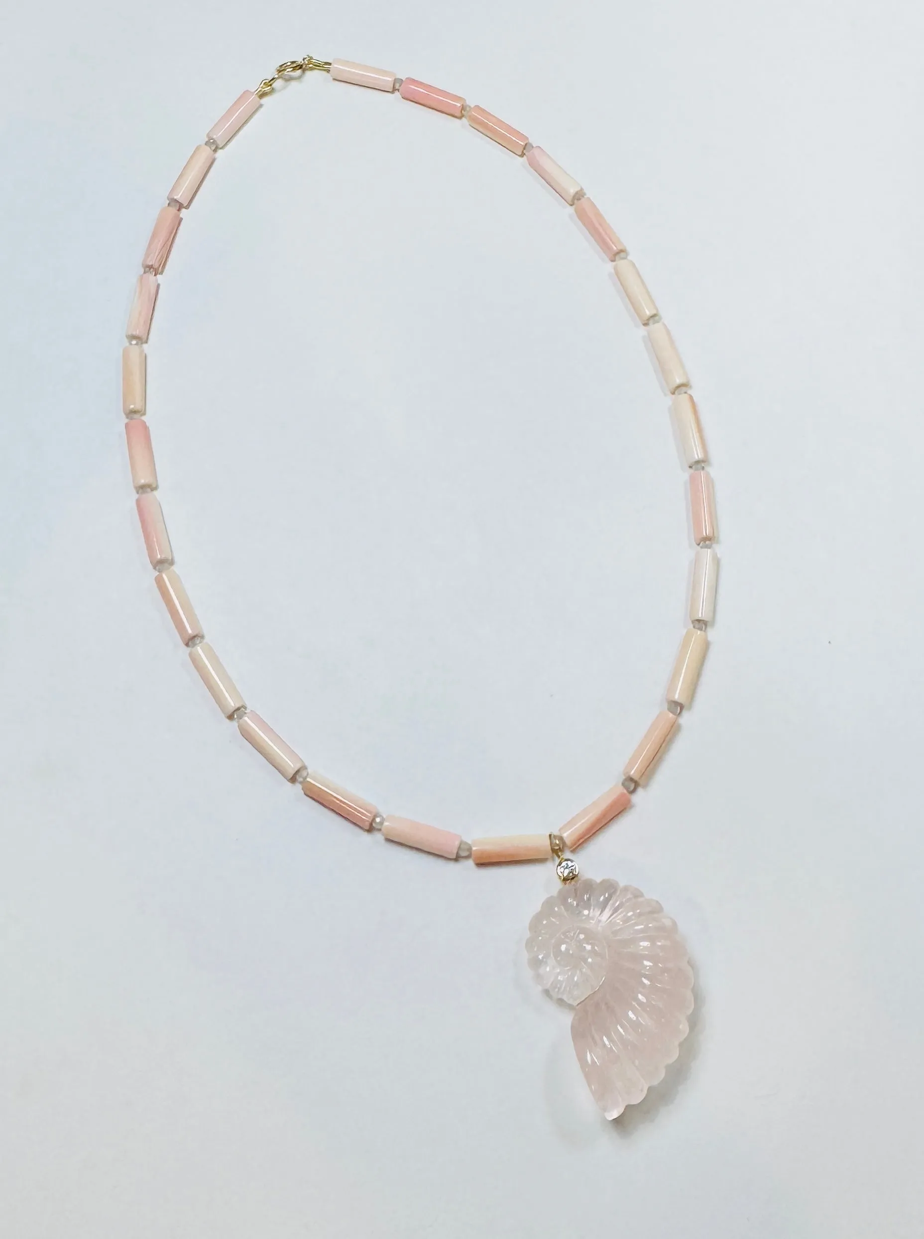 tube conch necklace with rose quartz nautilus pendant sold by Theodosia