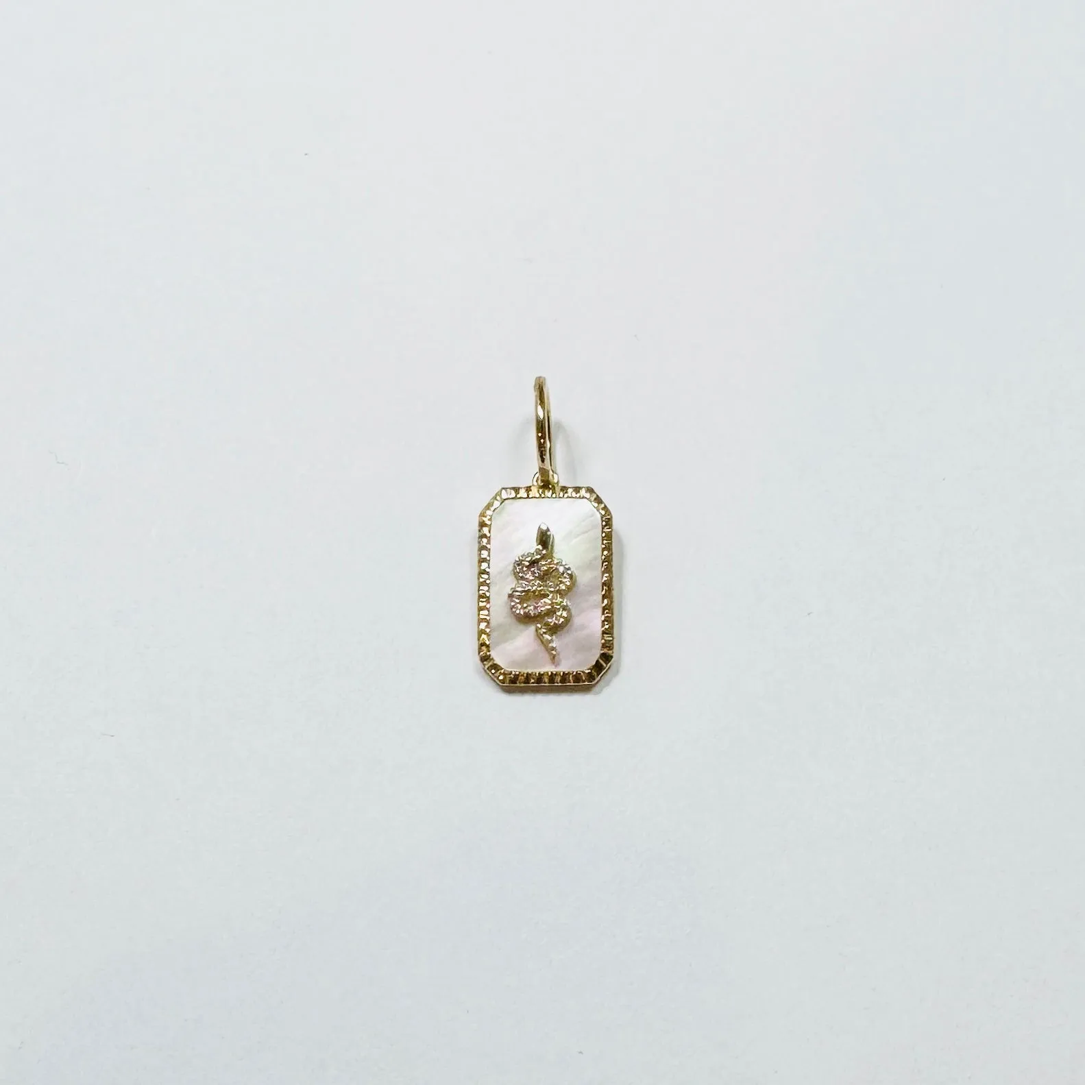 mother of pearl dog tag charm sold by Theodosia