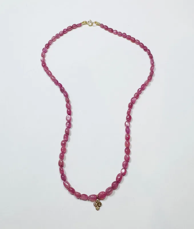 delicate pink sapphire seed bead necklace with bezel diamond charm sold by Theodosia