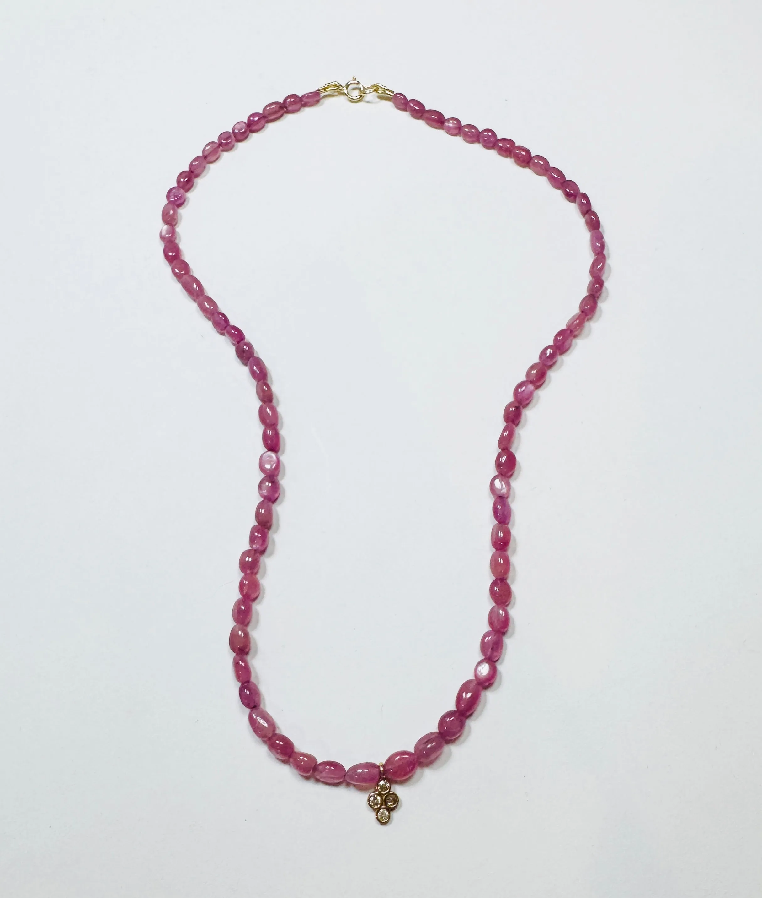 delicate pink sapphire seed bead necklace with bezel diamond charm sold by Theodosia