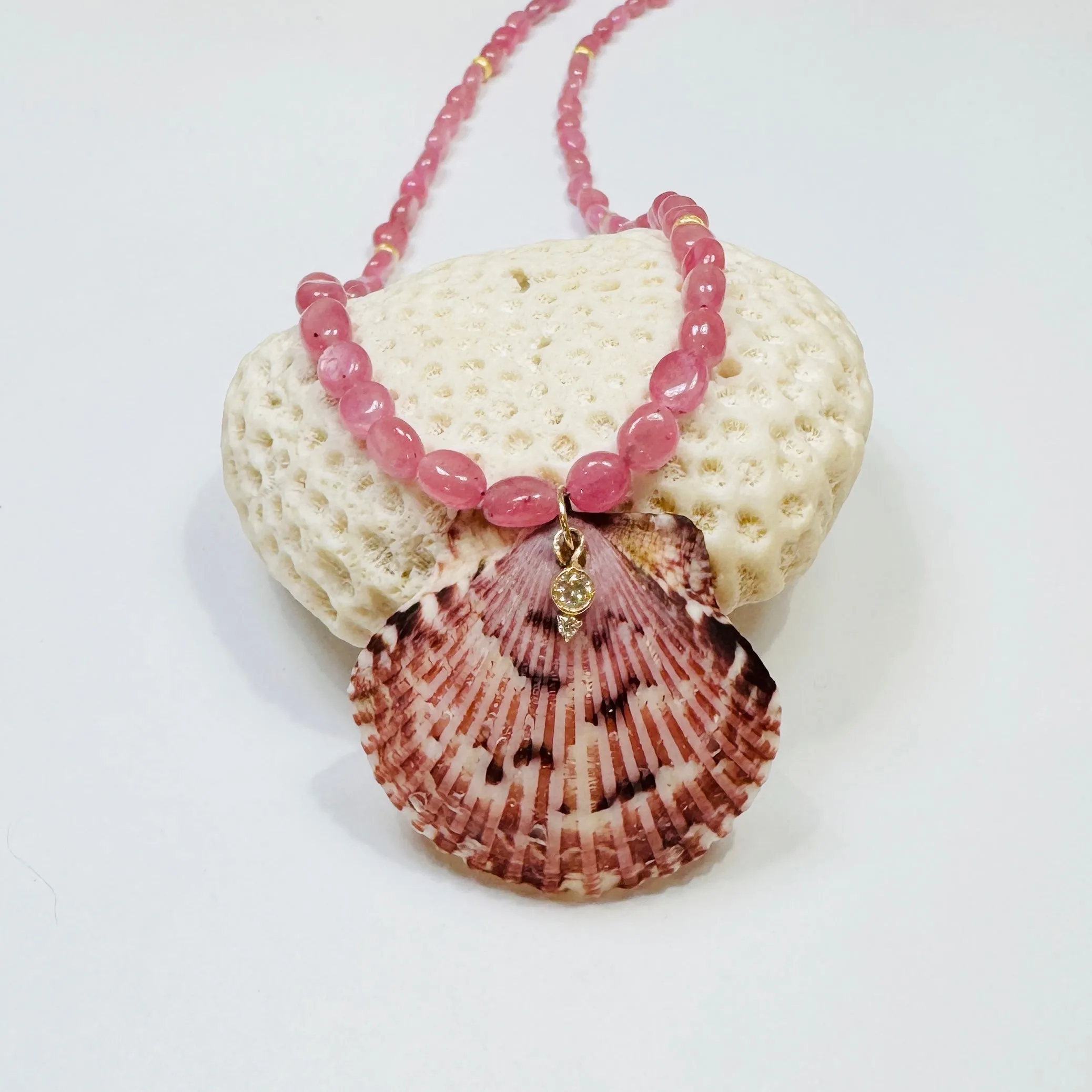 pink sapphire necklace with shell pendant sold by Theodosia