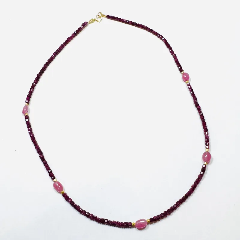 delicate with ruby block, pink sapphire, and gold beads sold by Theodosia