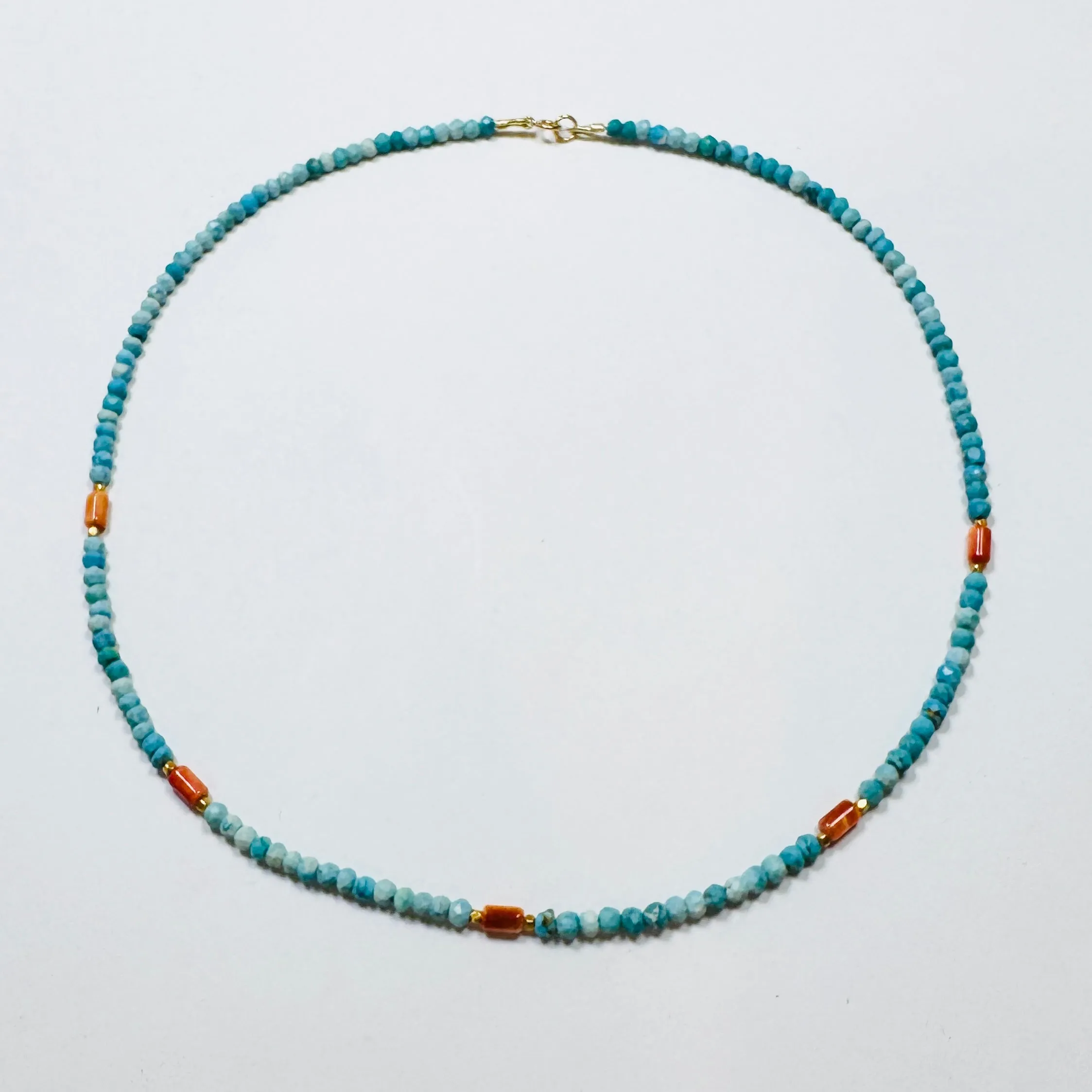 turquoise, coral, and gold beads sold by Theodosia
