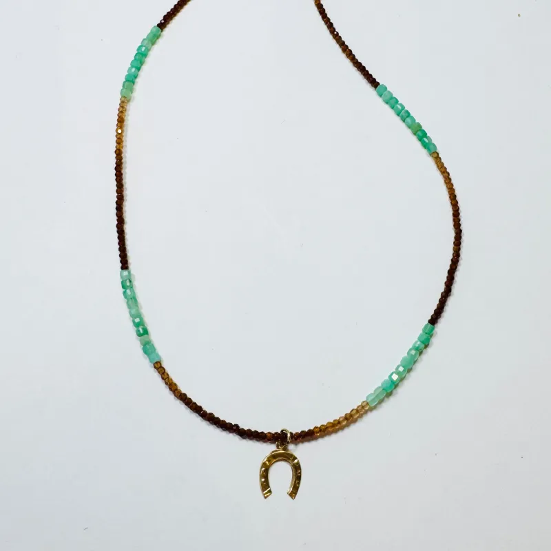 delicate horseshoe necklace sold by Theodosia