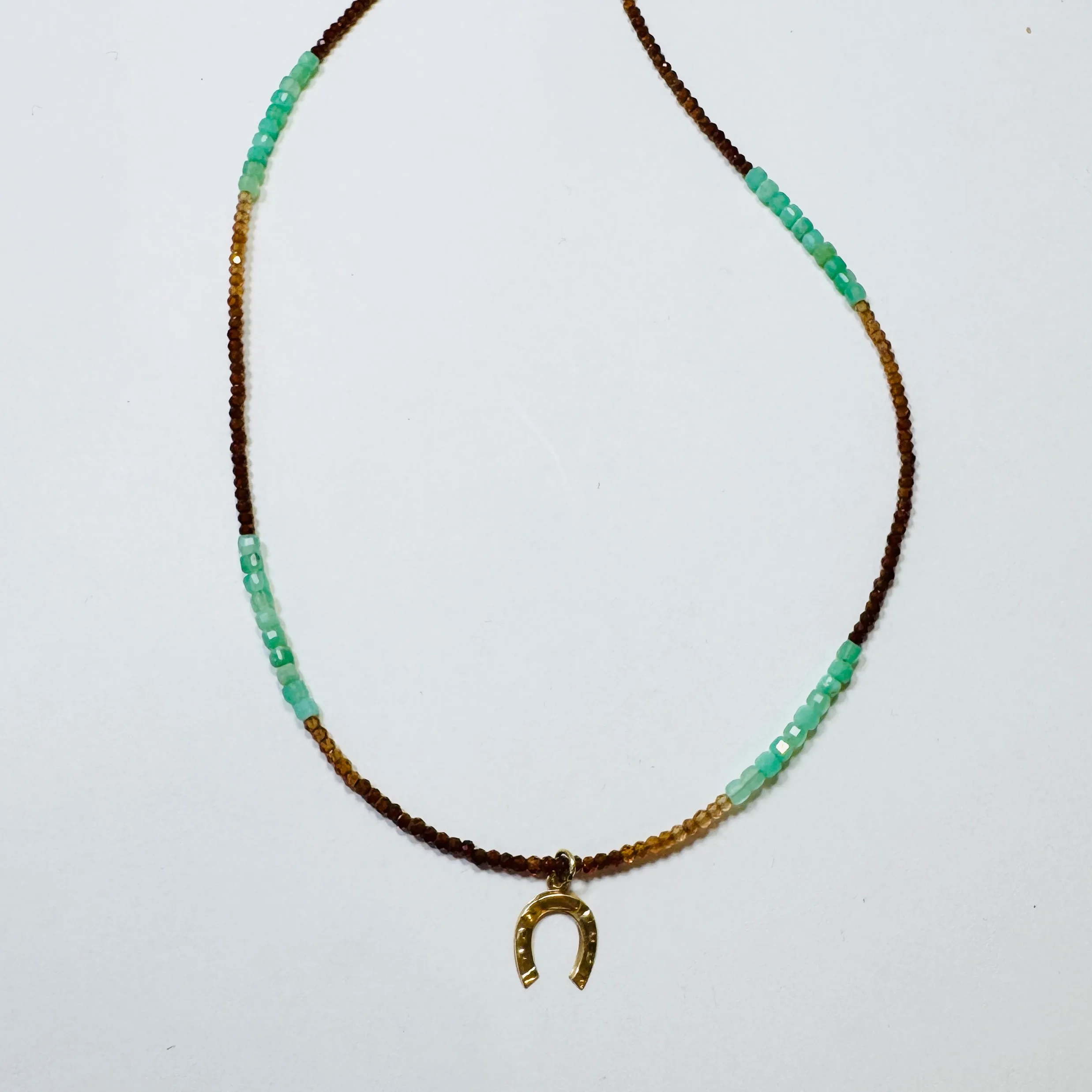 delicate horseshoe necklace sold by Theodosia