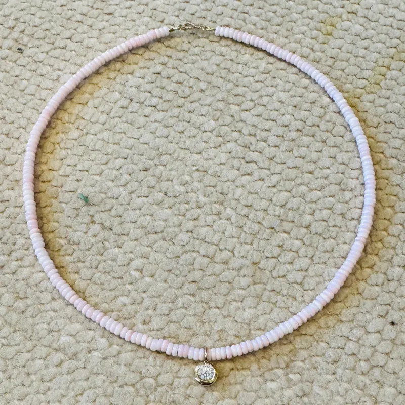 conch necklace with bezel diamond charm sold by Theodosia