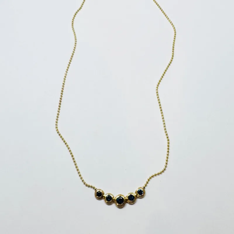 blue sapphire bezel set necklace sold by Theodosia