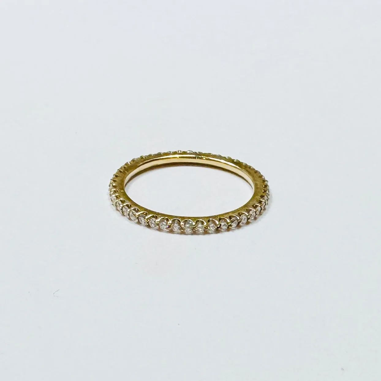 prong set diamond eternity band sold by Theodosia