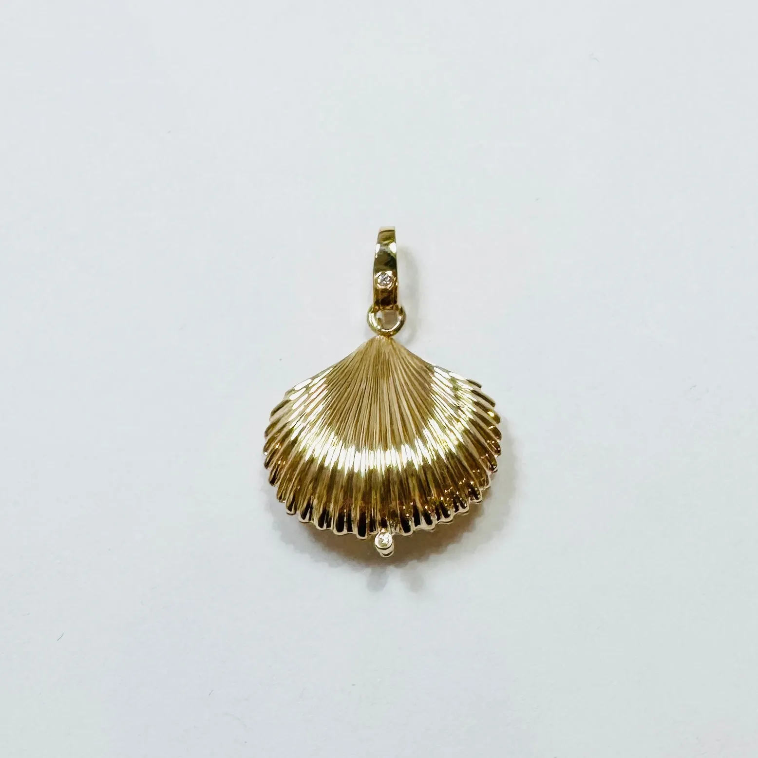 Shell locket pendant sold by Theodosia