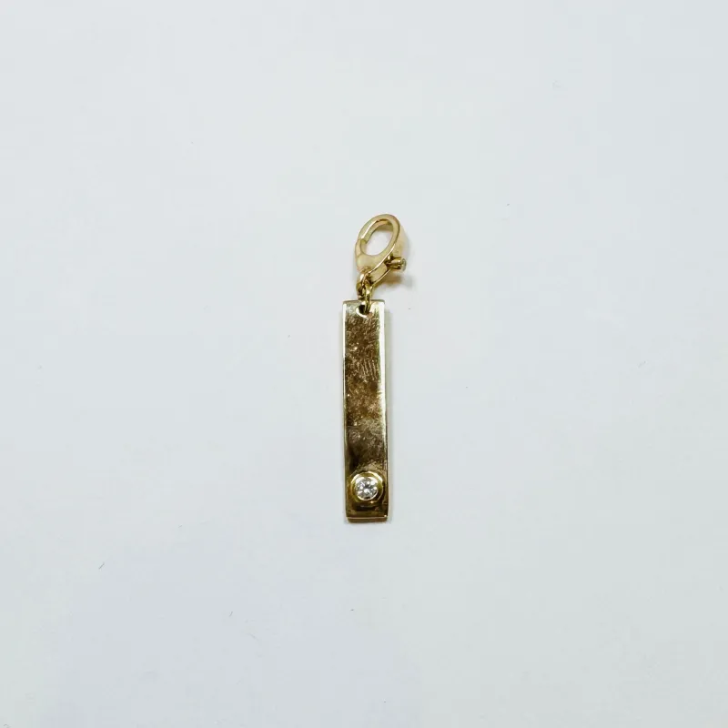 gold bezel set diamond dog tag pendant sold by Theodosia