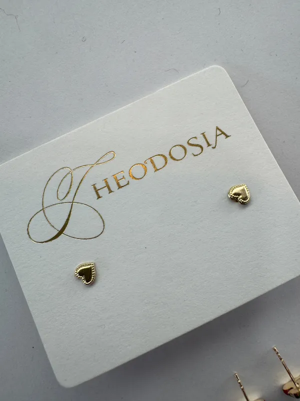 textured perimeter heart studs sold by Theodosia