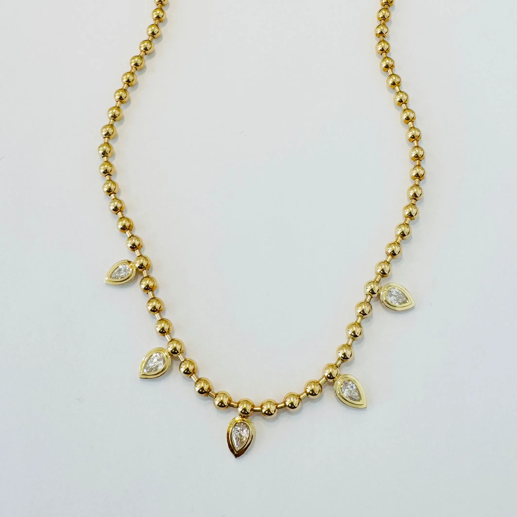 Diamond pear bezel ball necklace sold by Theodosia