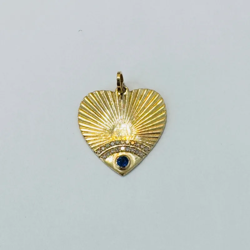 Fluted heart with blue sapphire sold by Theodosia