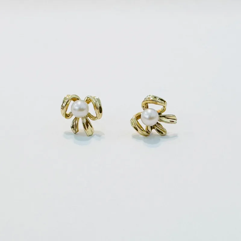 bow pearl studs sold by Theodosia
