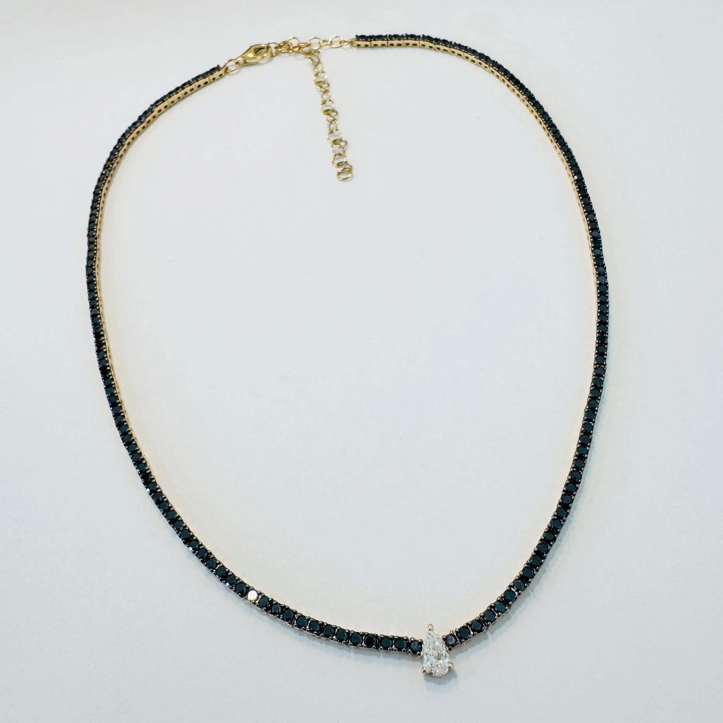 pear white diamond on black diamond tennis necklace sold by Theodosia