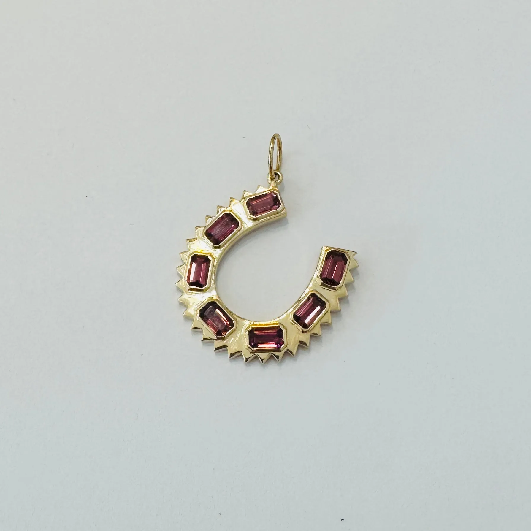 spike horseshoe pendant sold by Theodosia
