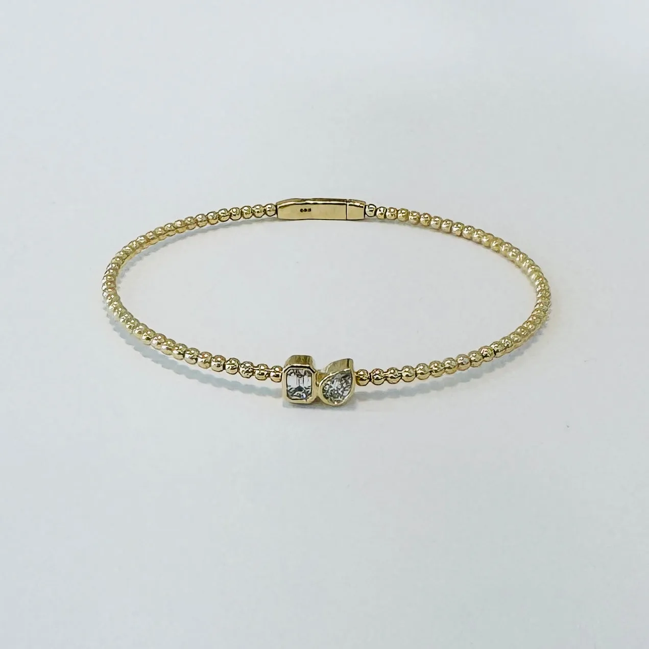 bezel set diamond bubble bangle sold by Theodosia