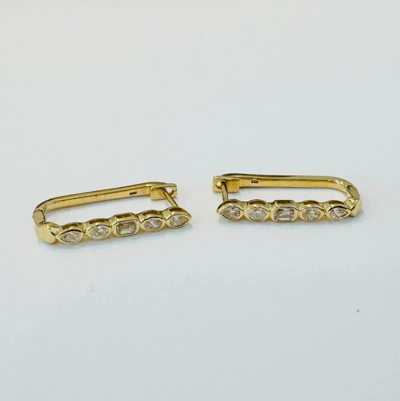 geometric elongated diamond huggies sold by Theodosia