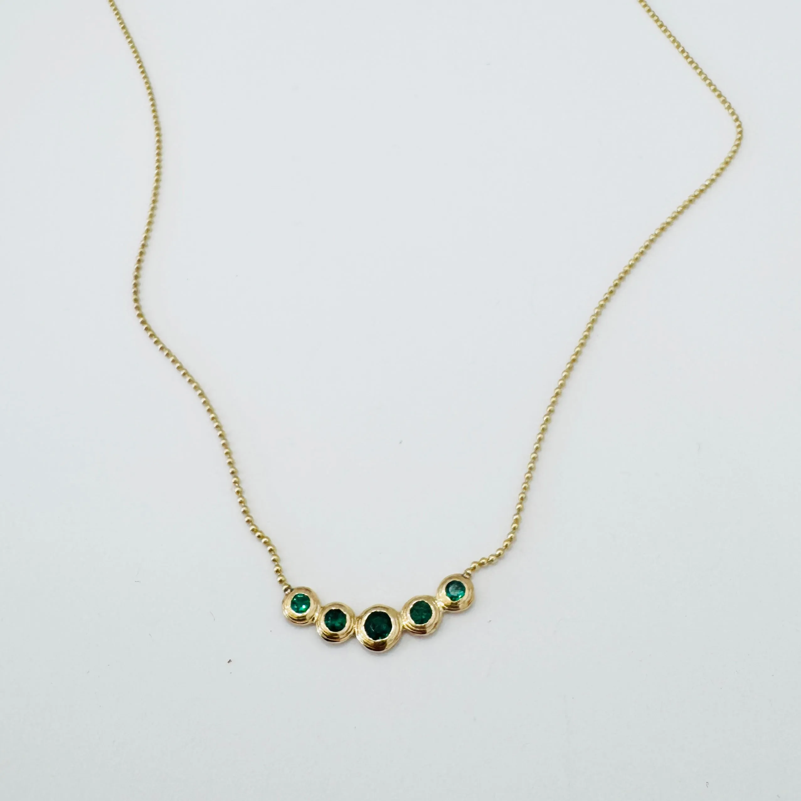 emerald bezel set necklace sold by Theodosia