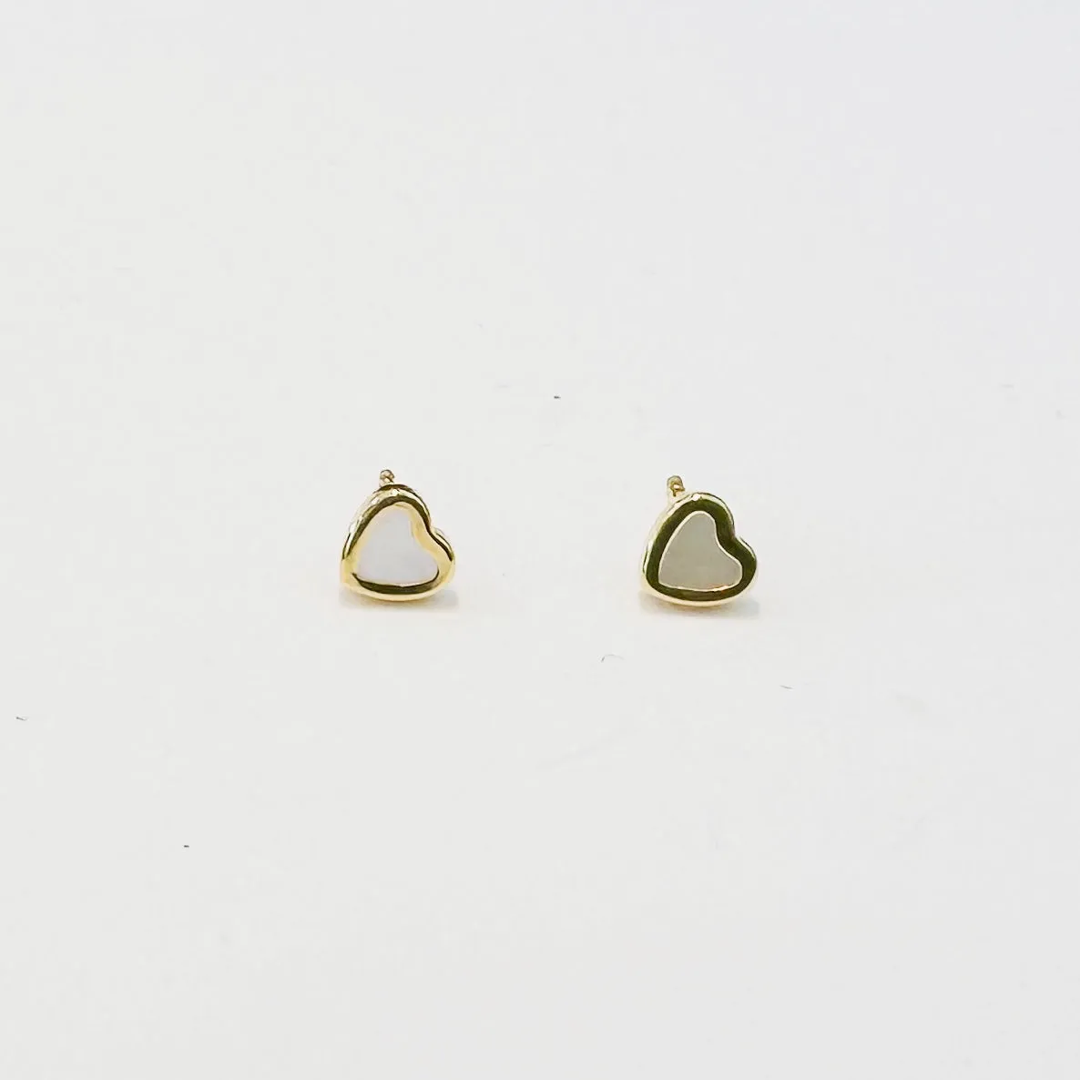 mini mother of pearl heart studs sold by Theodosia