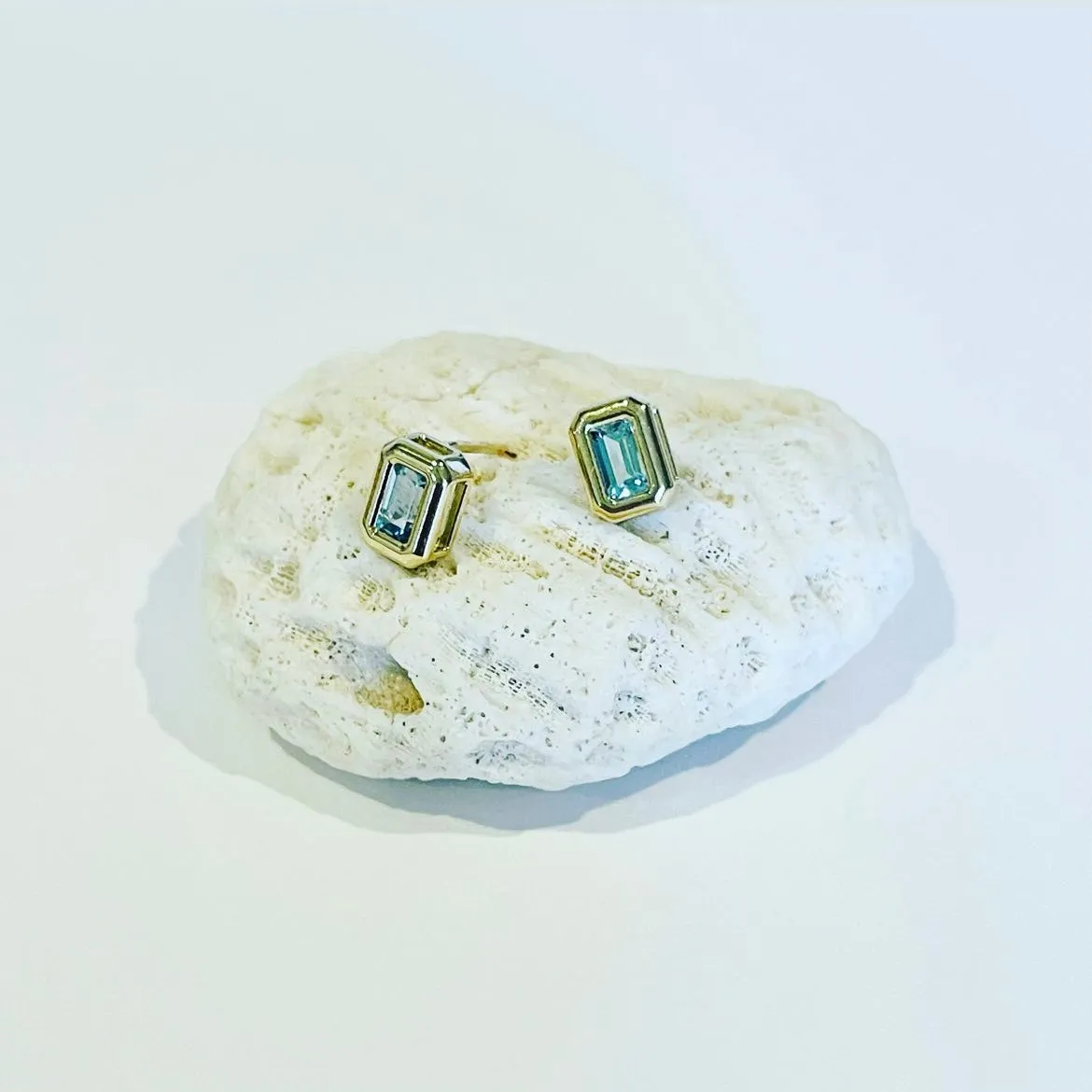sky blue topaz emerald cut studs sold by Theodosia