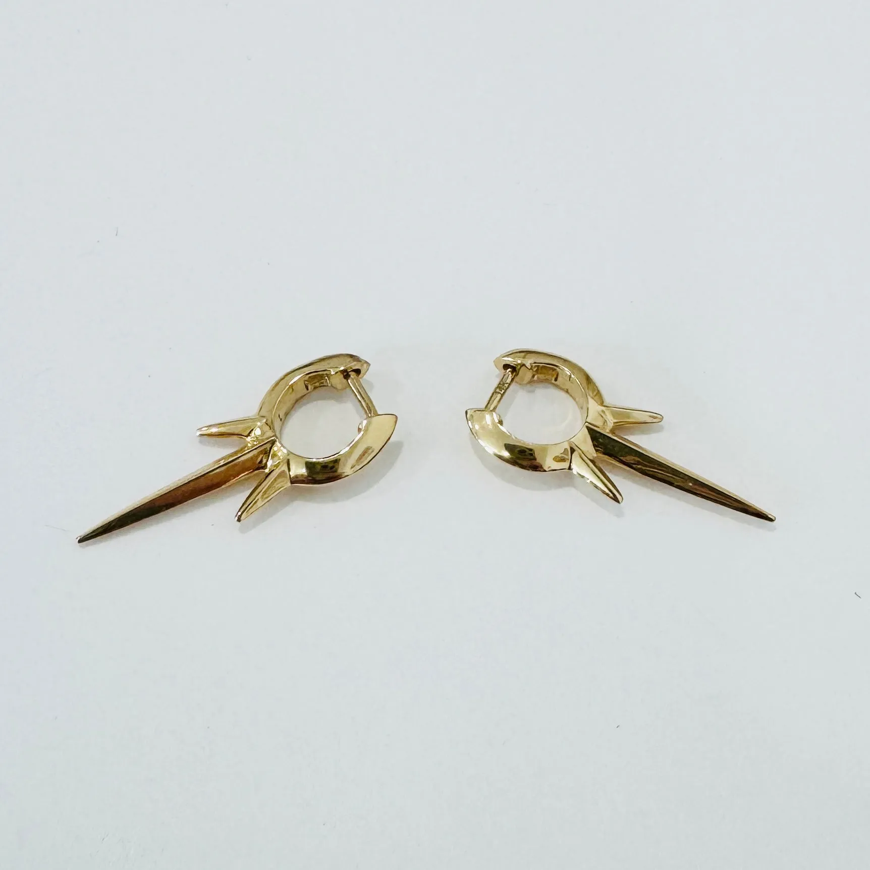 triple gold spike huggie sold by Theodosia