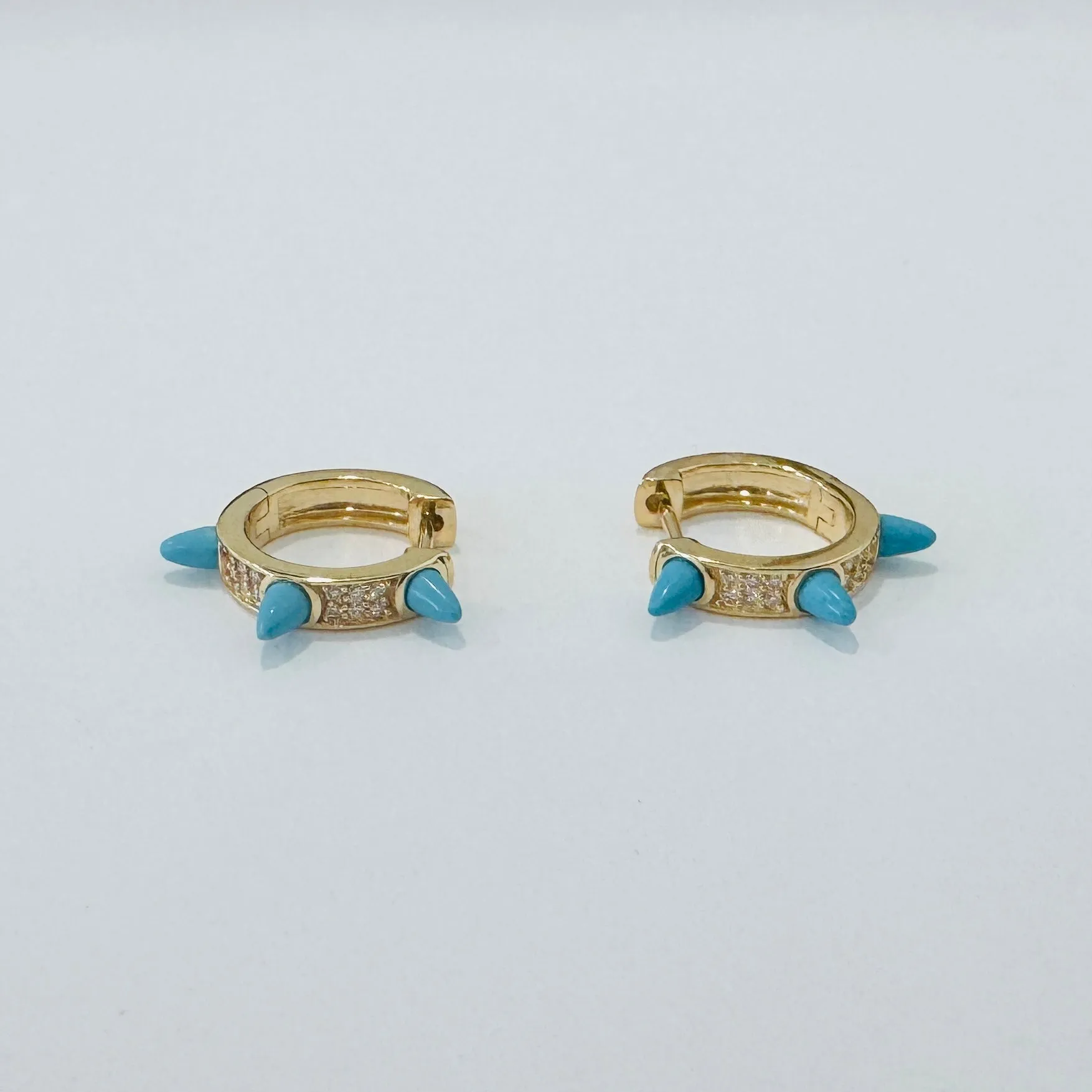 turquoise spike huggies sold by Theodosia