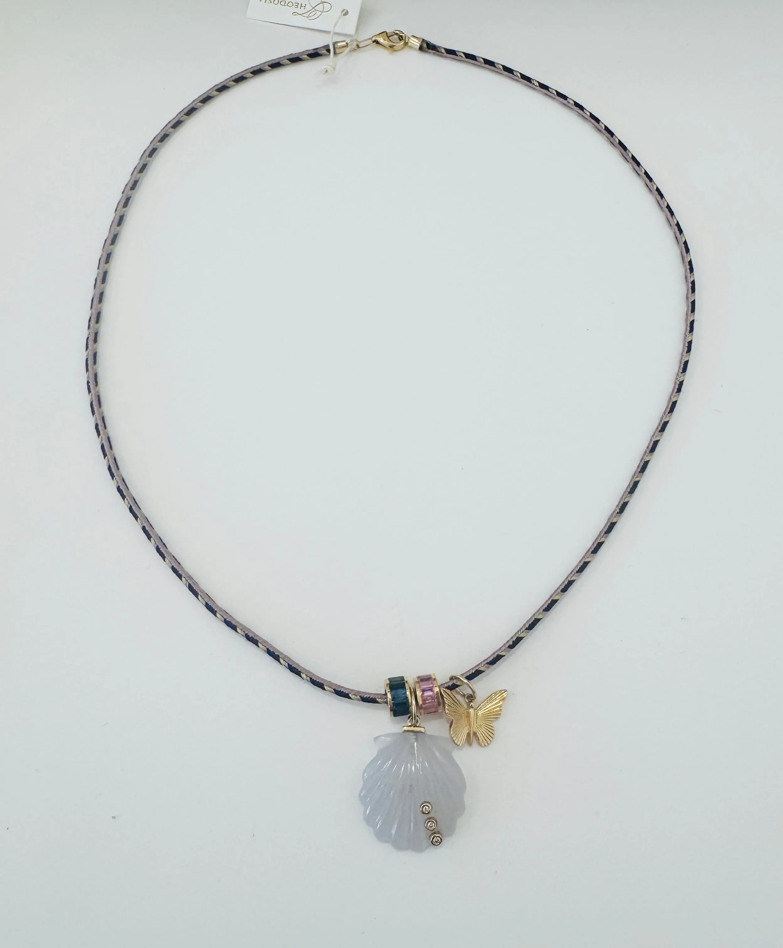 Kumihimo silk cord charm necklace, tan with nautilus, butterfly, and turquoise barrel sold by Theodosia