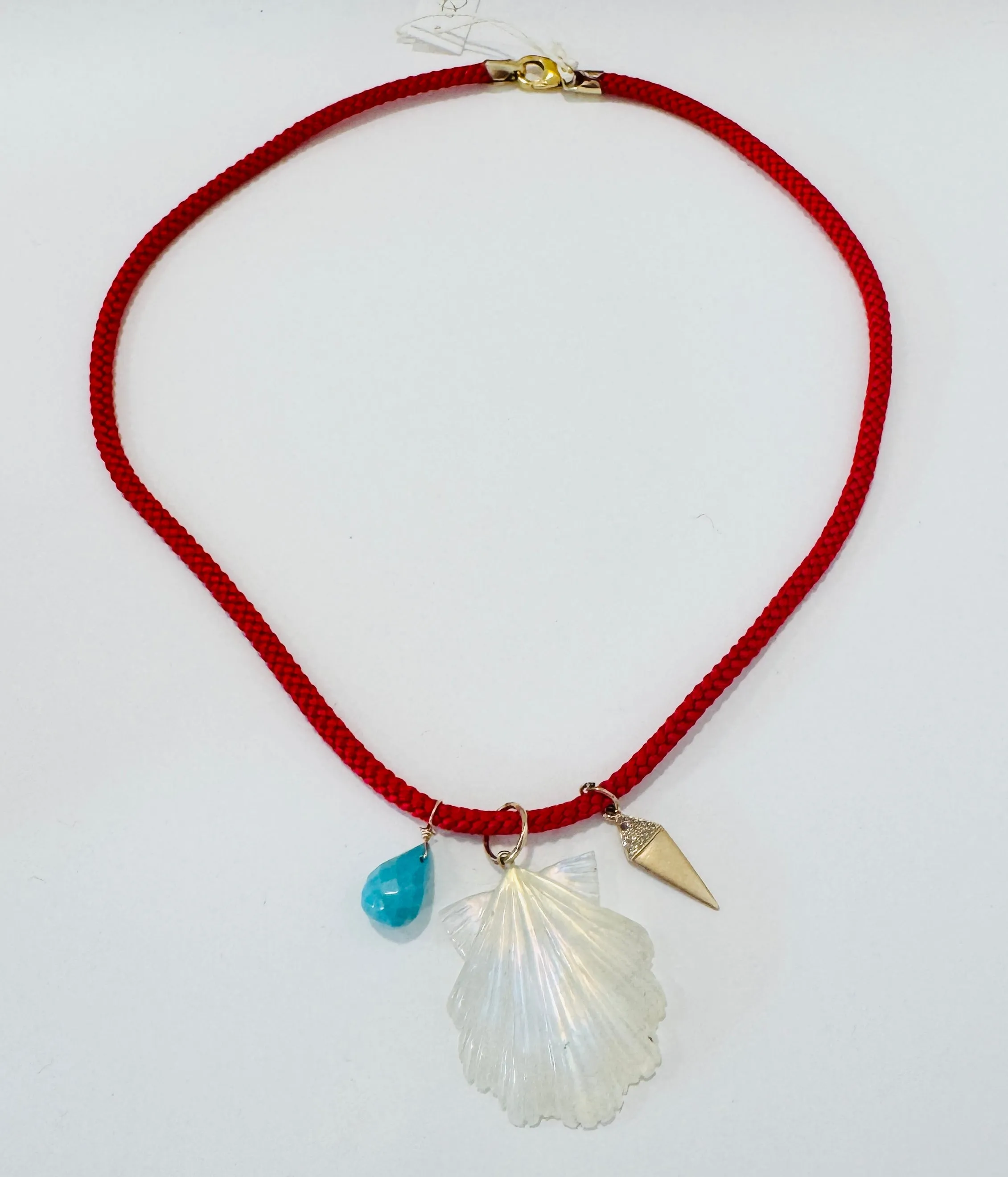 Kumihimo silk cord charm necklace, red with turquoise, moonstone carved shell, and 14 kt gold charm sold by Theodosia