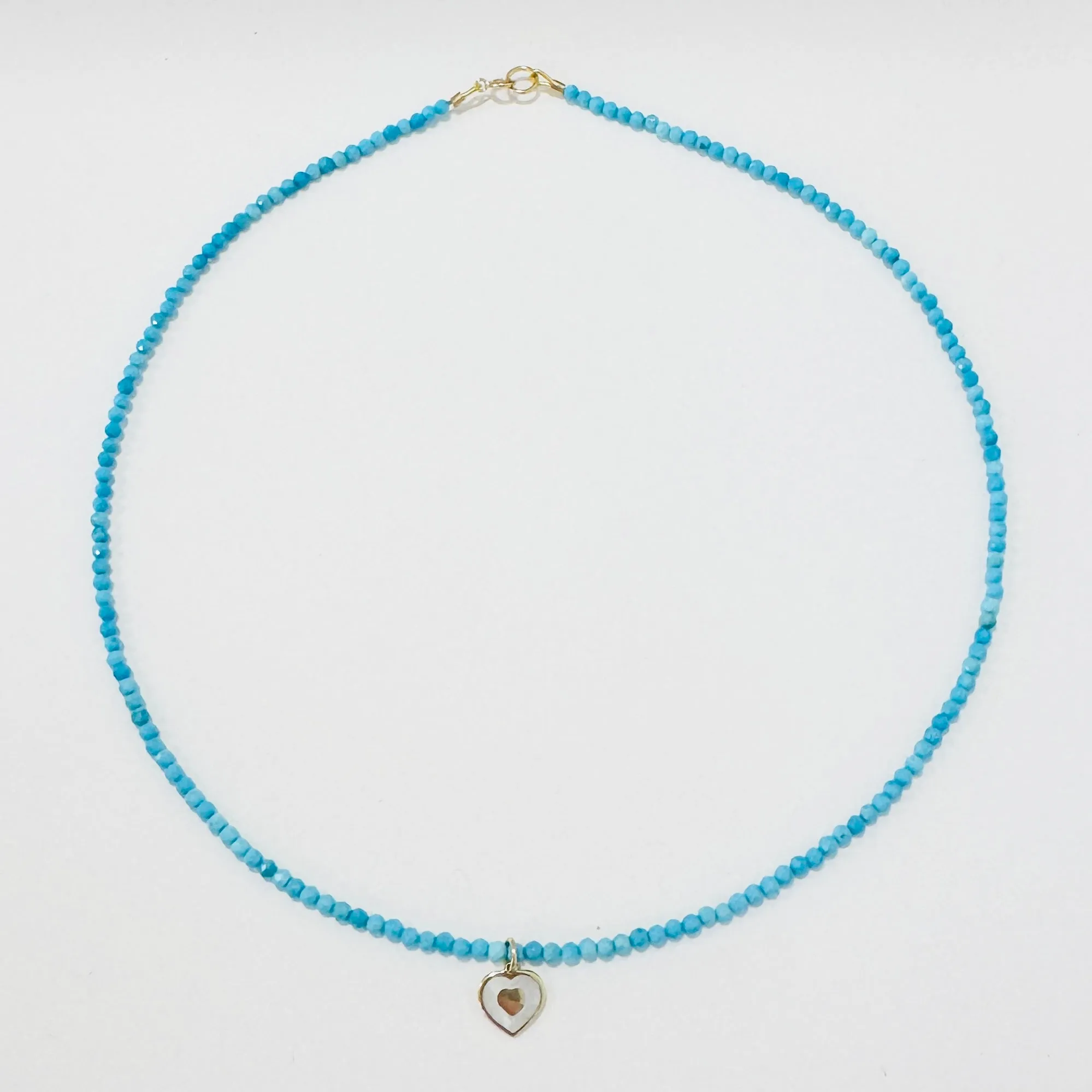 delicate gemstone necklace with mother of pearl heart charm sold by Theodosia