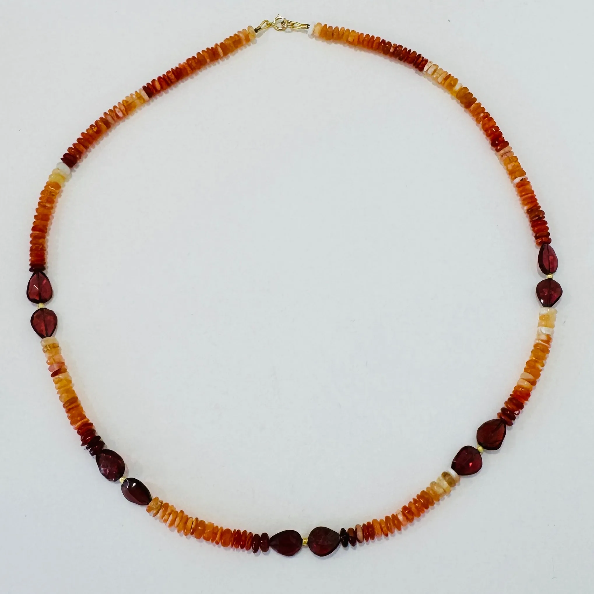 shaded fire opal and garnet necklace sold by Theodosia