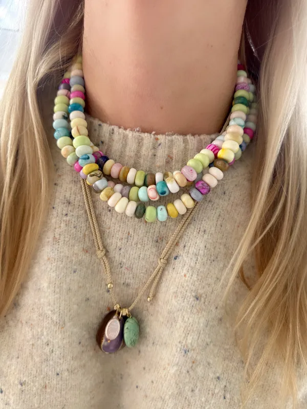 Kumihimo silk cord charm necklace, lavender with pearl, peach chalcedony, and purple cowrie shell made by Theodosia