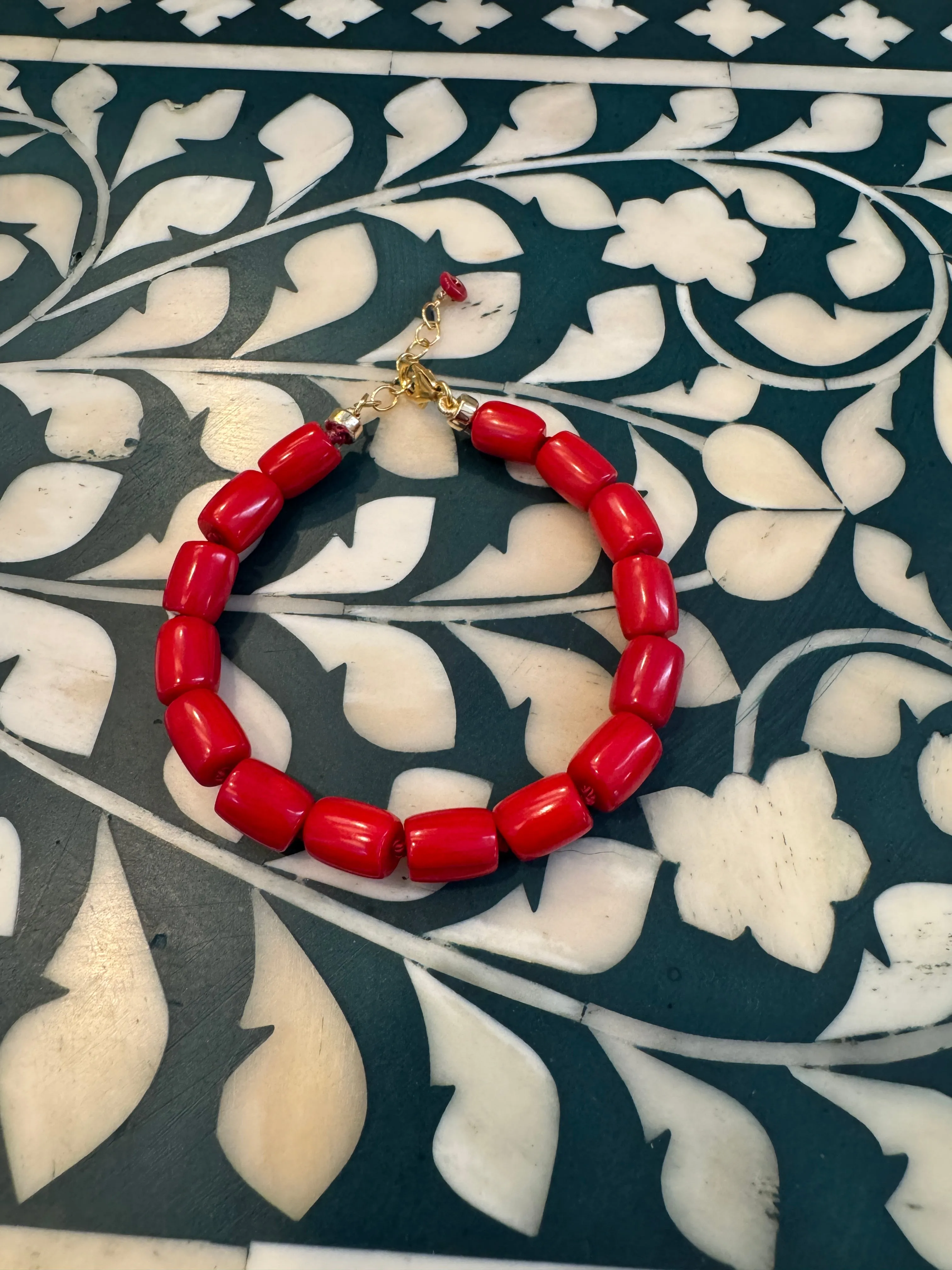 coral knotted bracelet sold by Theodosia