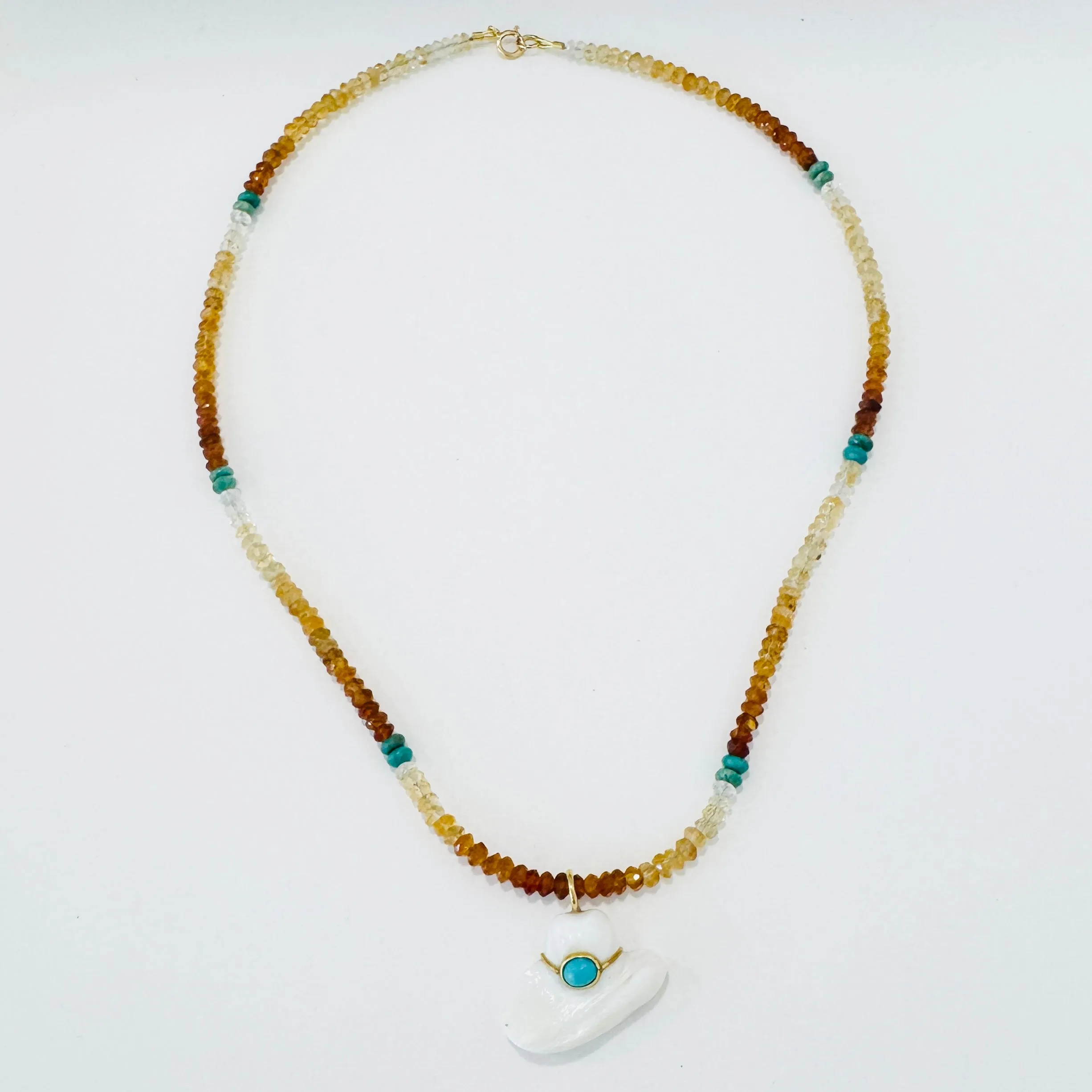 Hessonite garnet and turquoise with cowboy hat sold by Theodosia
