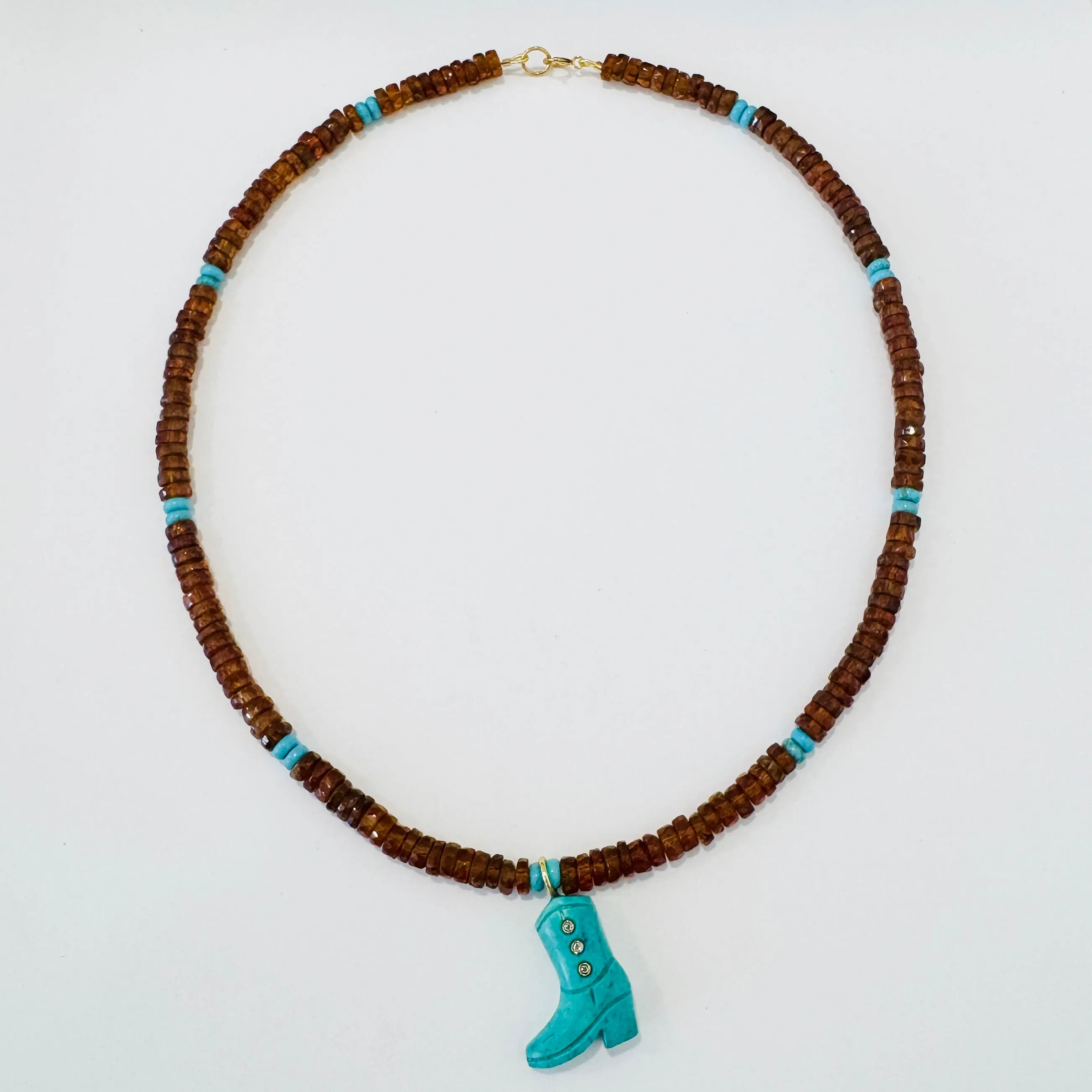 Hessonite garnet and turquoise with turquoise cowboy boot sold by Theodosia